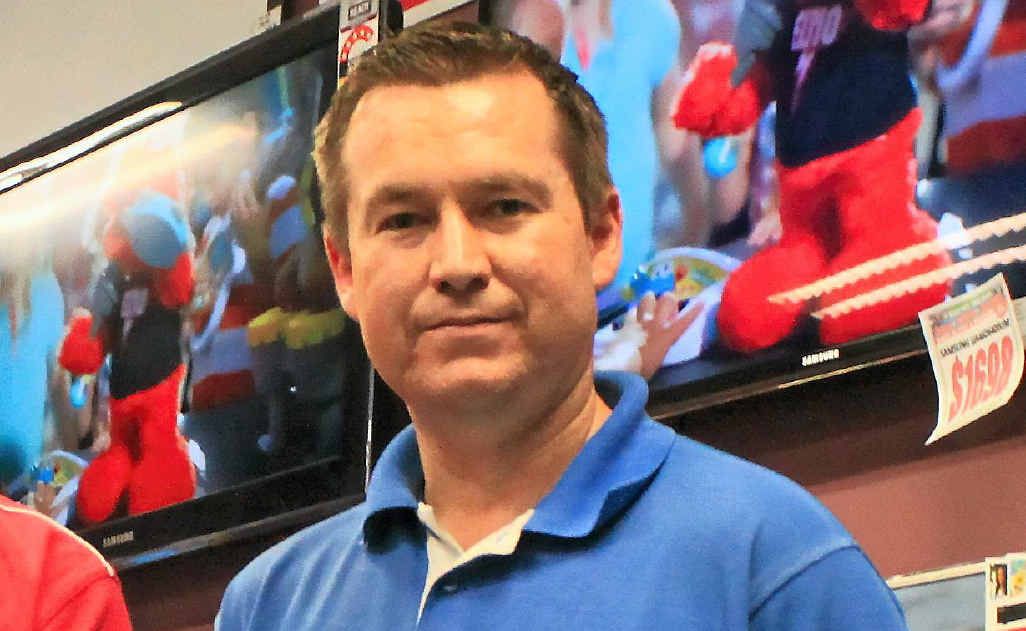 Harvey Norman franchisee Chris Robson with a set-top box. Harvey Norman franchisee Chris Robson with a set-top box.